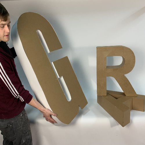 4 foot high and 2 foot high freestanding cardboard letters.