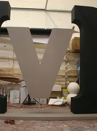 Giant black and white M event letter in the workshop
