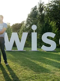 White WISE letters at an outdoor festival