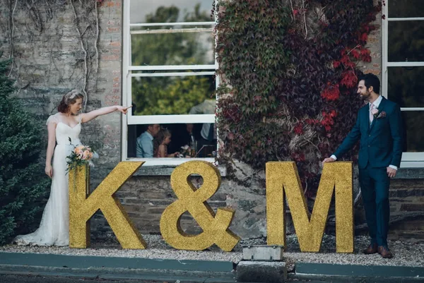 Large gold glitter polystyrene letters created for a wedding display