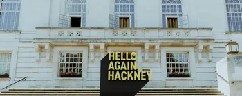 Large freestanding HELLO AGAIN HACKNEY sign outside Hackney Town Hall