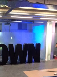 Large black John Brown display letters in an interior