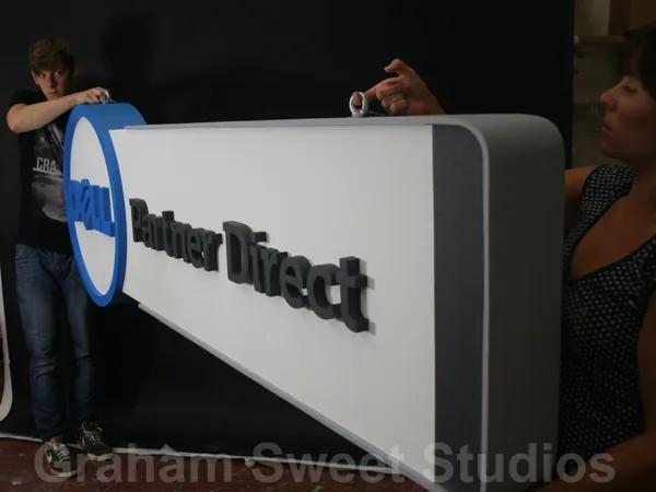 Dimensional Dell logo mounted on a display wall
