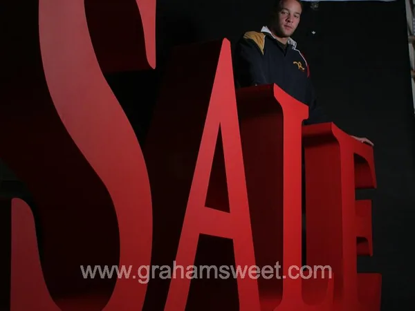 Large red SALE letters during manufacture