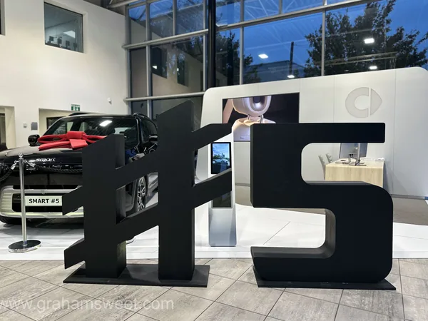Large black hashtag display letters at a Smart retail launch