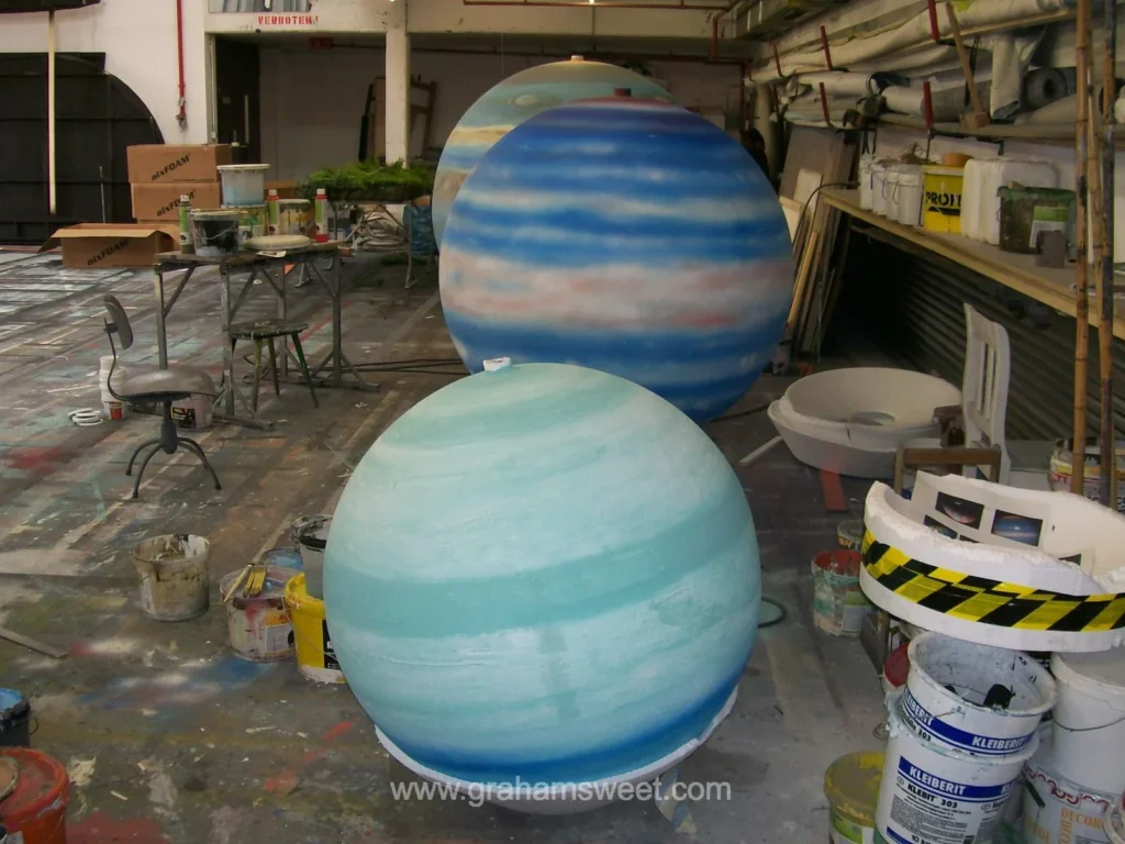 Large polystyrene spheres painted as planets in the Theater Koblenz workshop