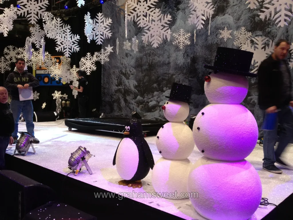 Large snowflakes being arranged on the Top of the Pops set