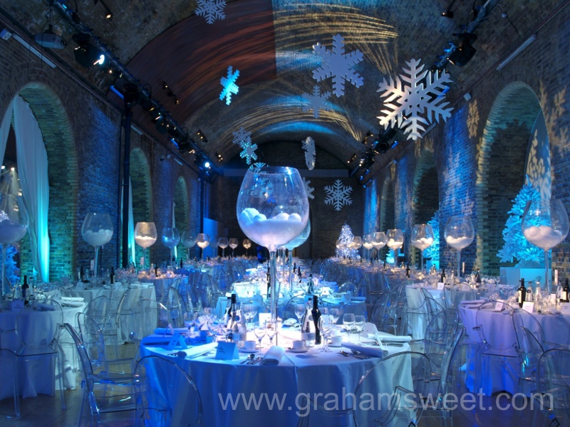 Hotel Christmas party venue decorated with oversized hanging snowflakes