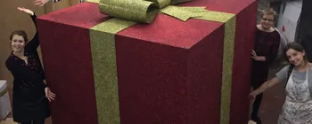 Giant red and green glitter Christmas present prop