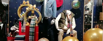 Gold glitter bauble shelves in a Coes Christmas retail display