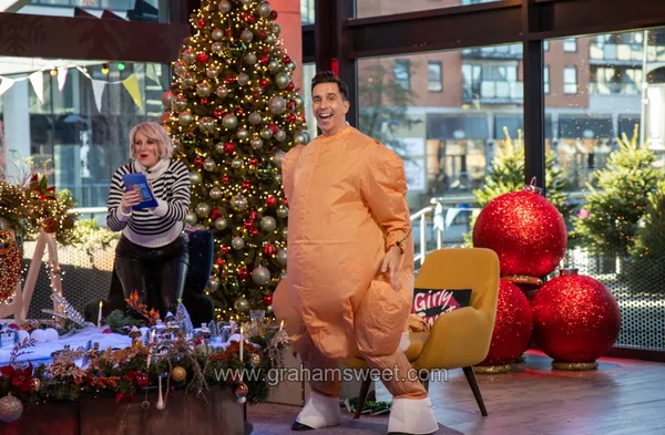 Christmas props surrounding the presenter on Steph's Packed Lunch