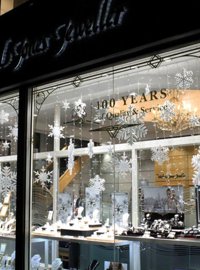 Polystyrene snowflakes displayed in the Christmas windows of Michael Jones Jeweller