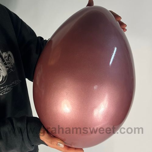 easter egg prop- coated with finerock, finished metallic pink