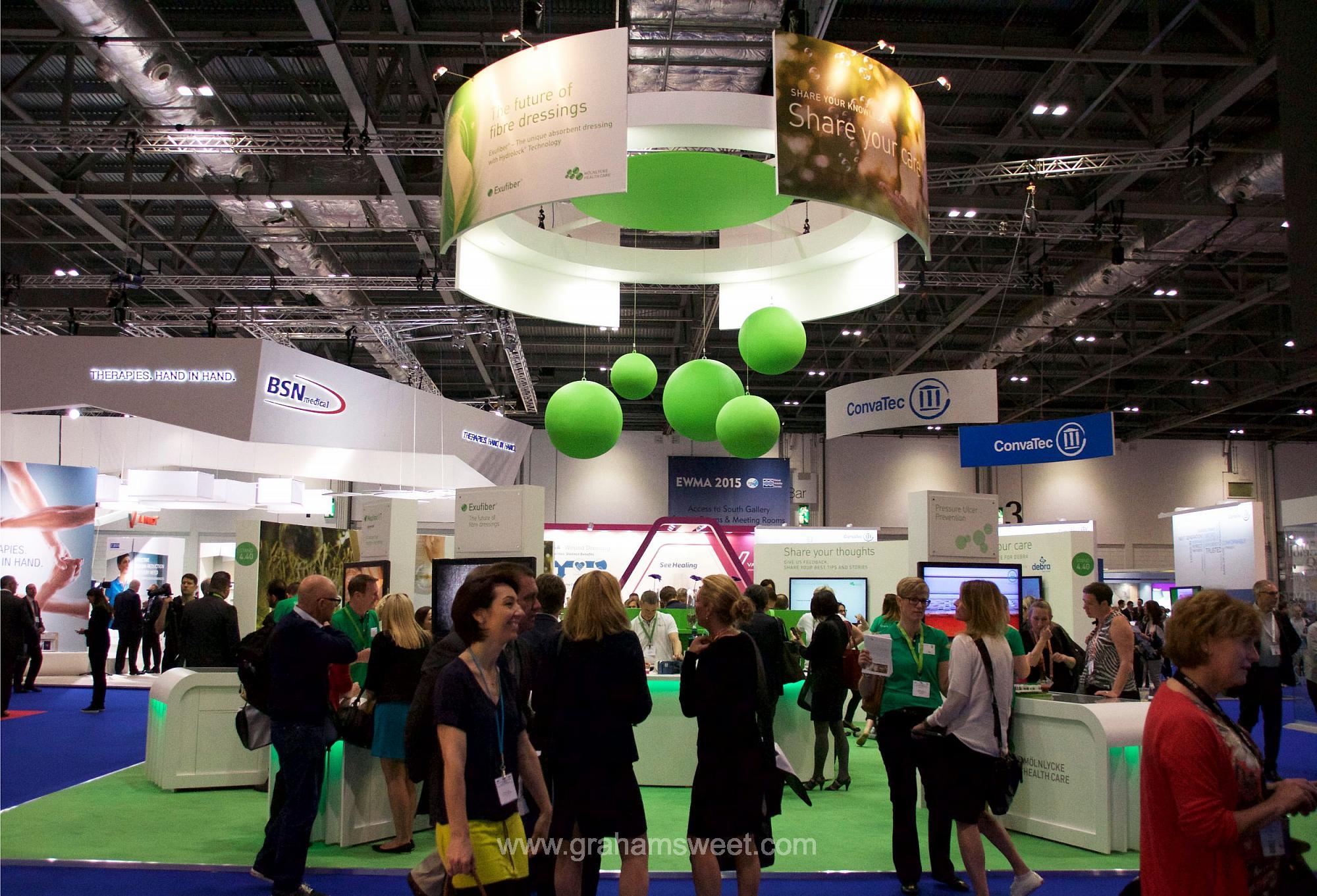 giant green balls - suspended at an exhiibition