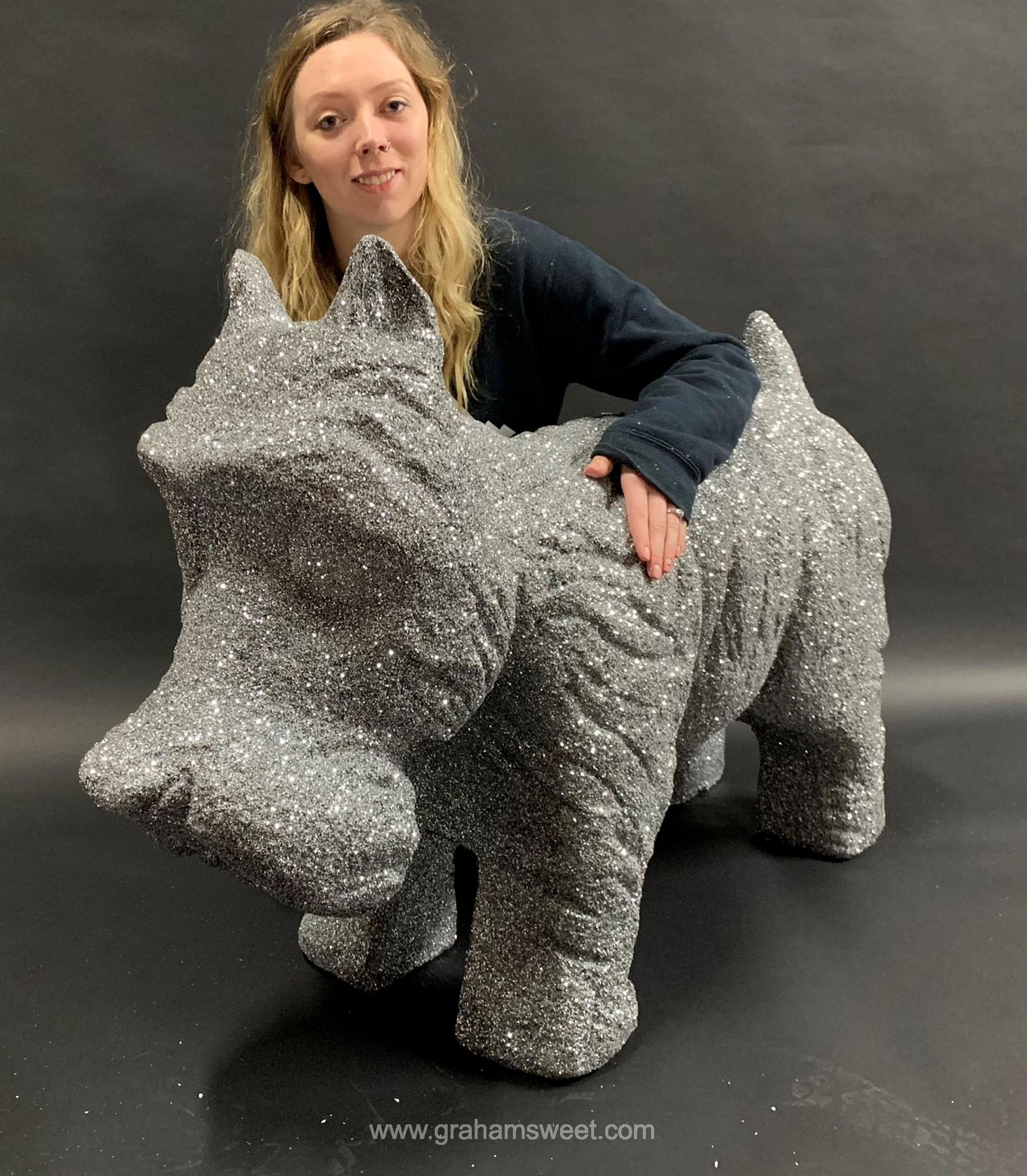 polystyrene sculpture of a dog - covered with sliver glitter