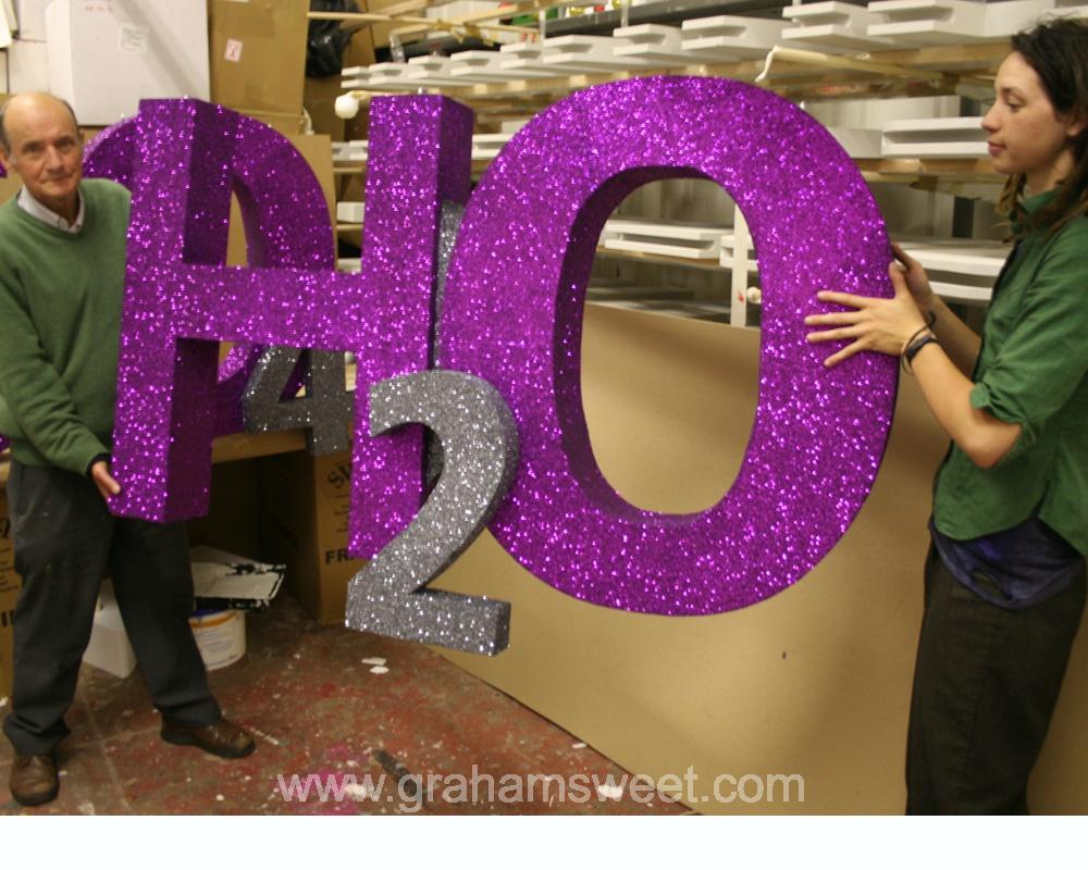 1000mm high - H2O logo - covered in glitter