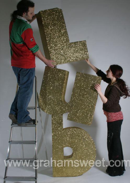 gold glittered polystyrene letters