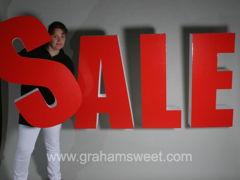 red sale letters - Impact condensed - vinyl faced - suspended