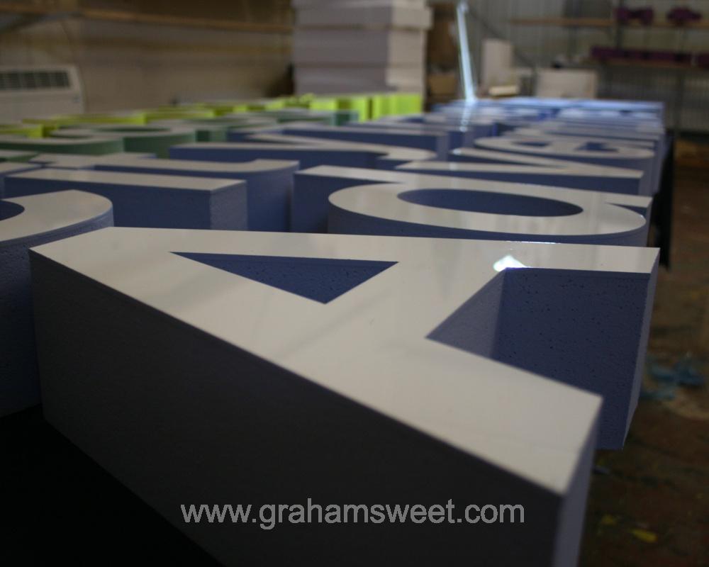 polystyrene letters - faced with white acrylic - sides painted various colours
