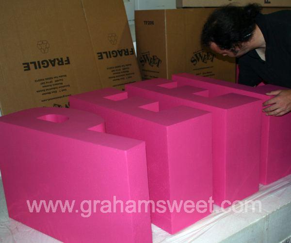 big pink painted polystyrene letters