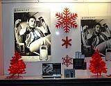 red glittered snowflakes window display