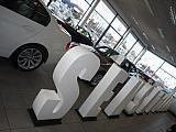 poly letters in BMW garage.