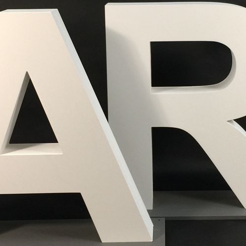 selection of white mdf and plywood wooden letters