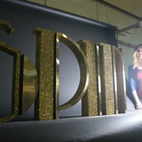 Polystyrene spin letters, gold glitter with brushed gold laminate.