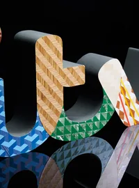 Colourful patterned ITV letter display