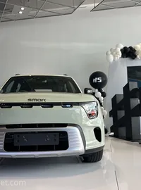 Large display letters beside a car