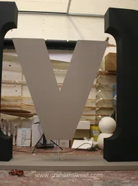 Large dimensional V logo being manufactured