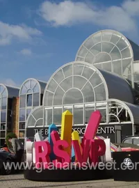Colourful RSVP event letters outside a venue