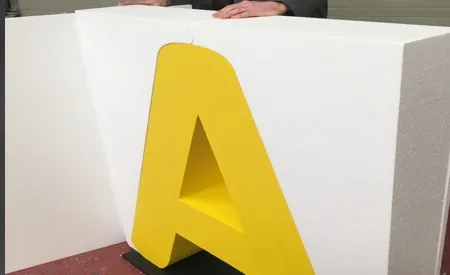 Yellow polystyrene letter protected inside its original sheet